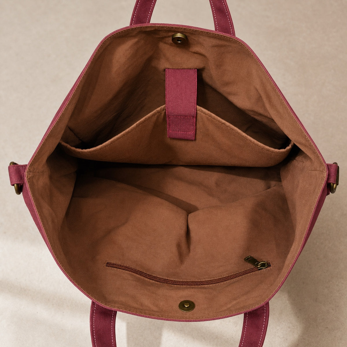 Interior of the OMONDI washed canvas tote with organized compartments